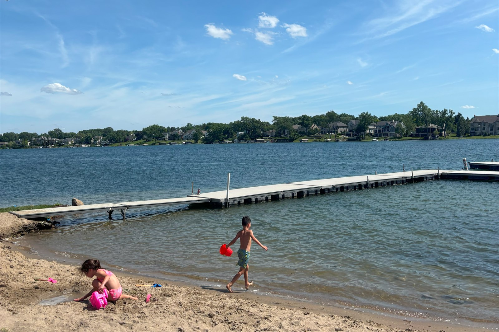 Children at the private beach beside the swim platform