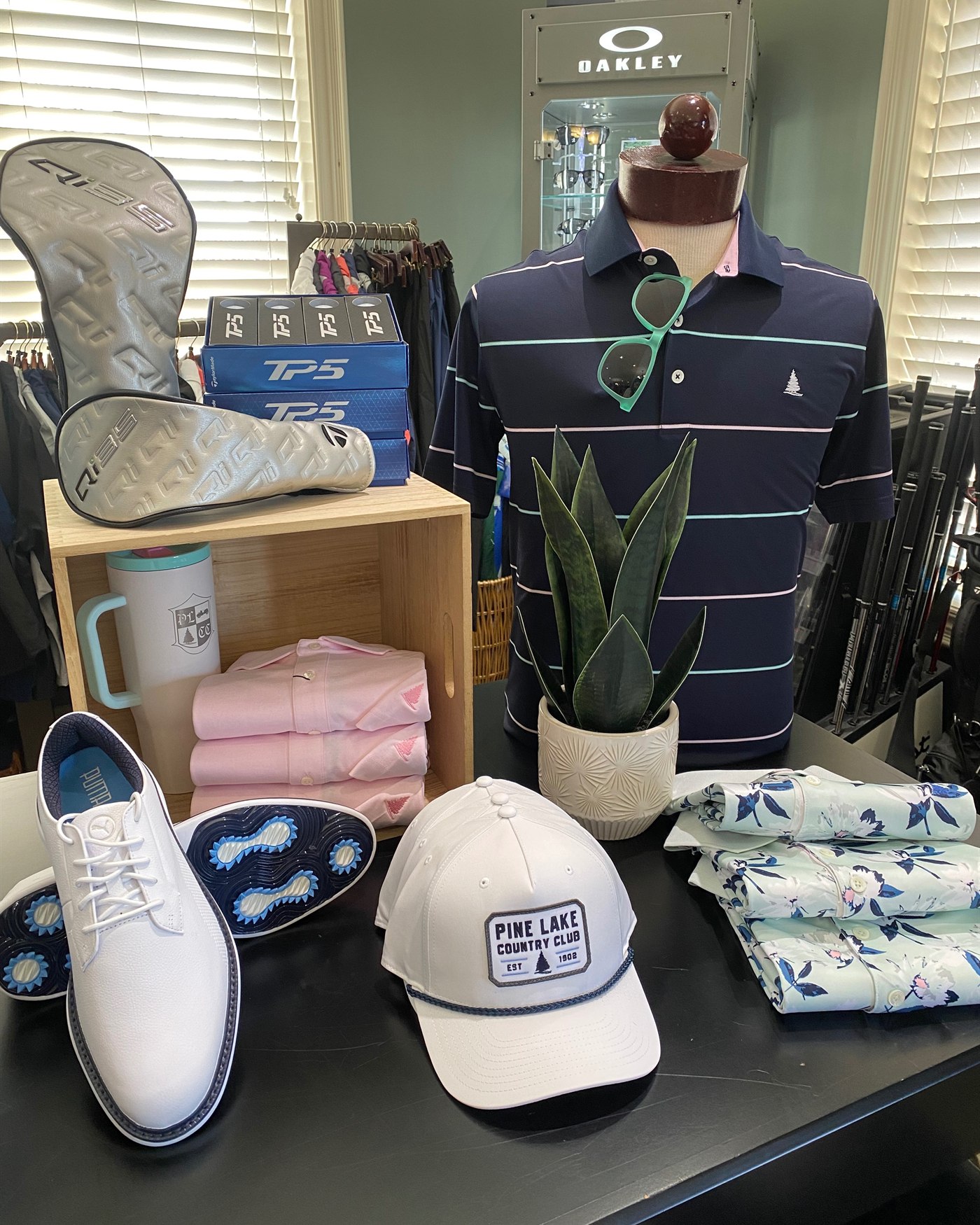 Pine Lake logo caps, golf shoes and apparel on display in the golf shop