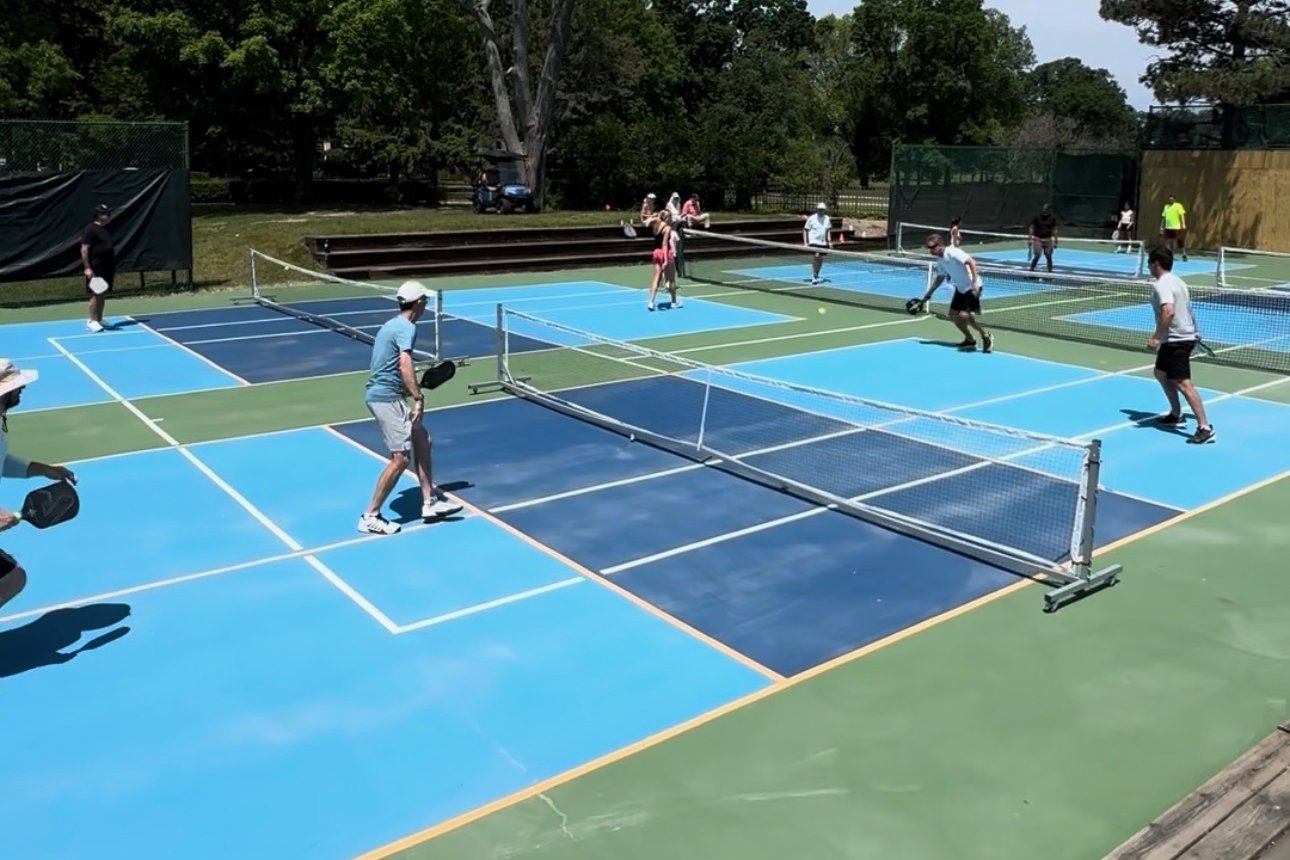 Members playing pickleball at Pine Lake
