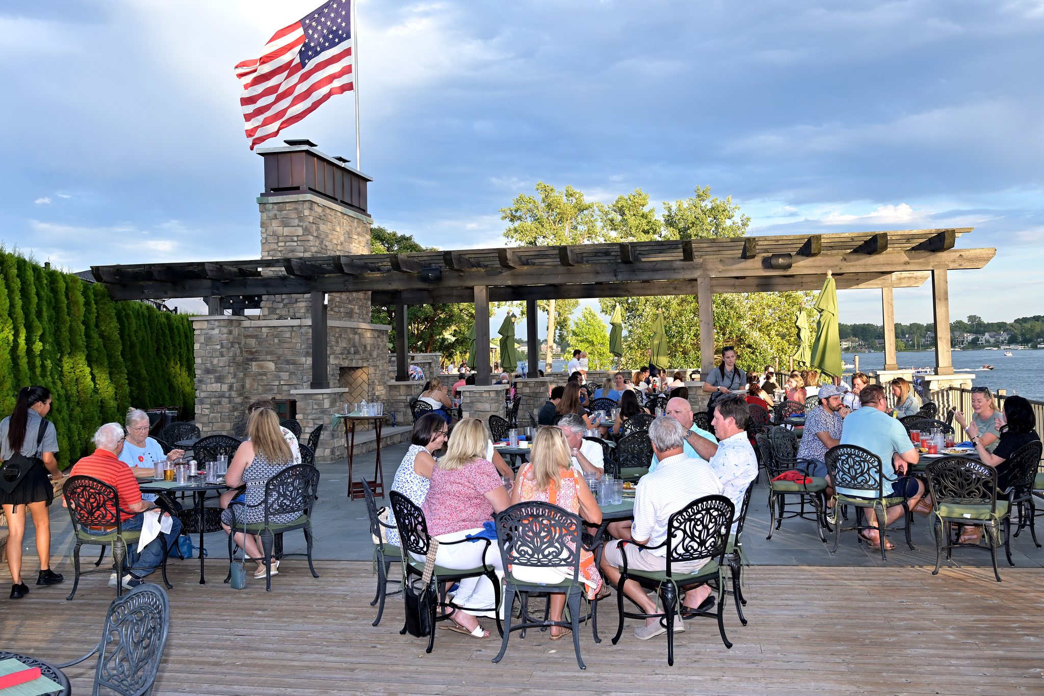 Members on the terrace at Pine Lake