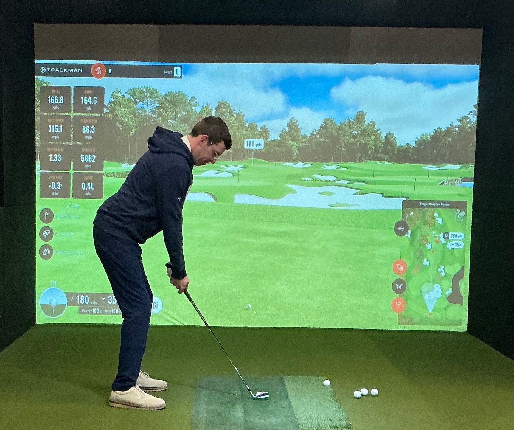 A member on the TrackMan simulator at Pine Lake